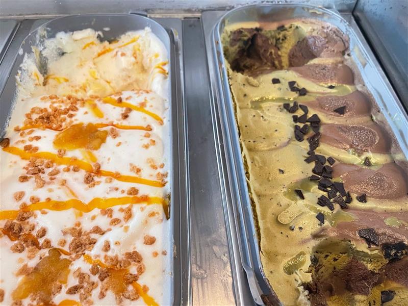 Two tubs of house ice cream in the dessert case