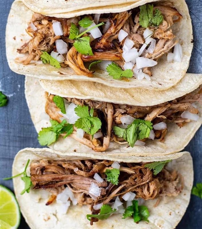 Pulled pork tacos with onion and cilantro