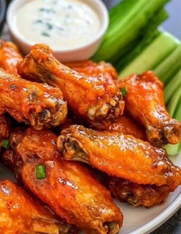 Glazed chicken wings with ranch and celery