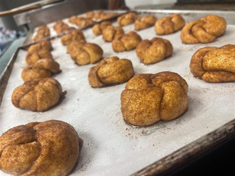 Cinnamon sugar knots on a baking sheet